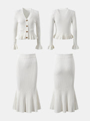 White knit cardigan with ruffled hem and bell sleeves, paired with a matching mermaid skirt.