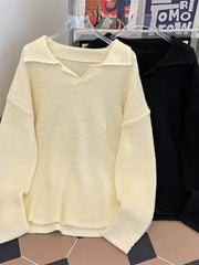 Textured knit polo collar sweater in apricot with a relaxed fit and V-neck.