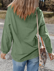 Sage corduroy sweatshirt with textured stripes and long sleeves.