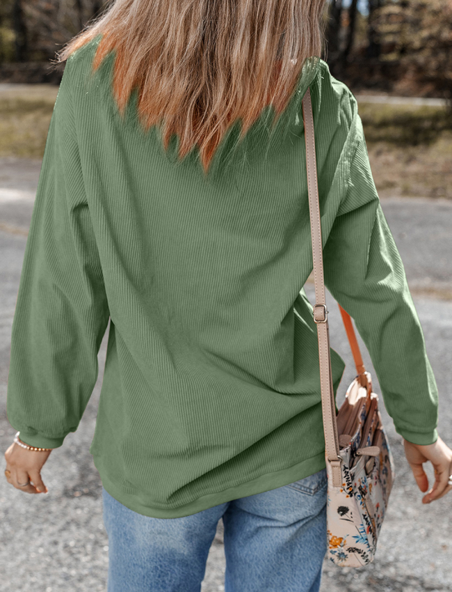 Sage corduroy sweatshirt with textured stripes and long sleeves.