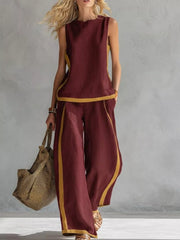Wine red sleeveless tank and wide-leg pants set with yellow trim, polyester, women's outfit.