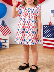 Toddler dress with ruffle sleeves, white with red and blue stars and wavy stripes pattern.