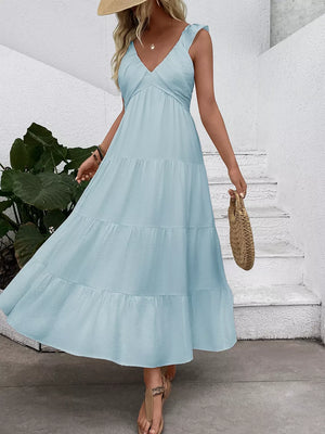 Light blue tiered maxi dress with flutter sleeves and V-neck, perfect for summer.