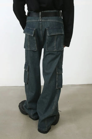 Dark denim cargo pants with multiple pockets and a relaxed fit.