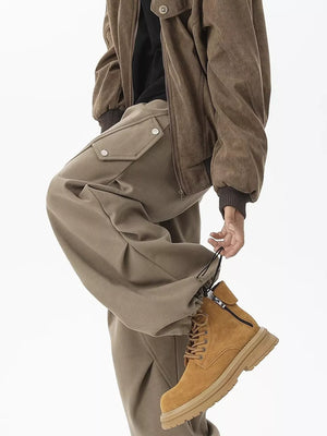 Khaki cargo sweatpants with snap-button pockets and adjustable drawstring cuffs.
