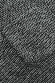 Distressed knit sweater in dark gray with a textured pocket detail.