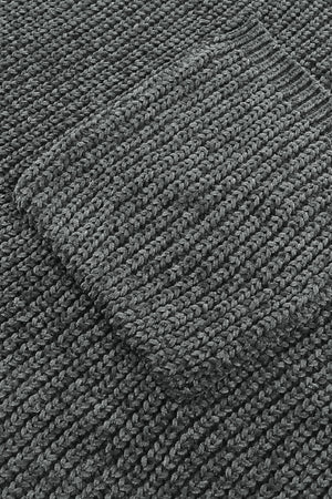 Distressed knit sweater in dark gray with a textured pocket detail.