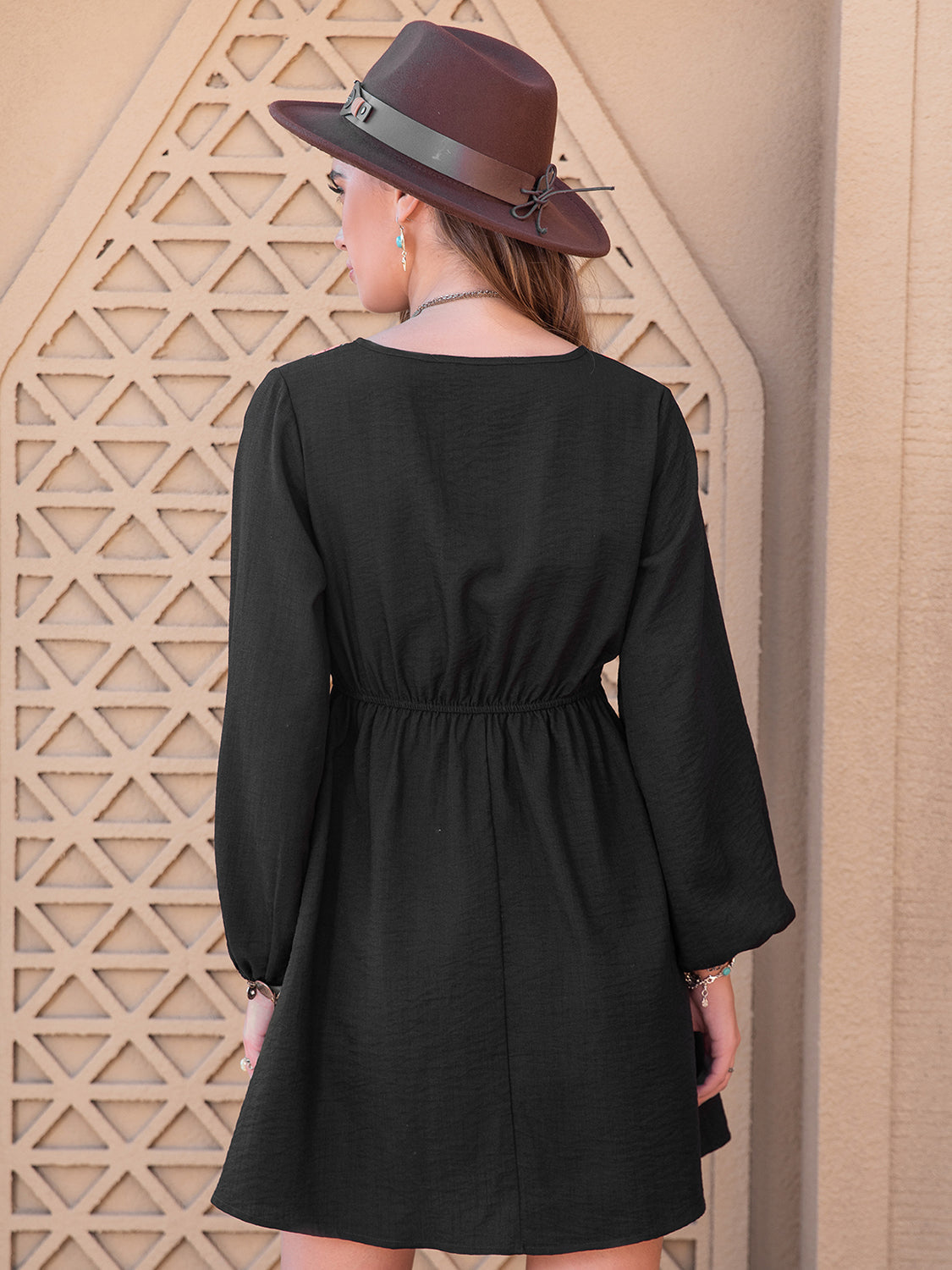 Black embroidered yoke mini dress with long sleeves and elastic waist