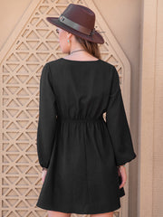 Black embroidered yoke mini dress with long sleeves and elastic waist