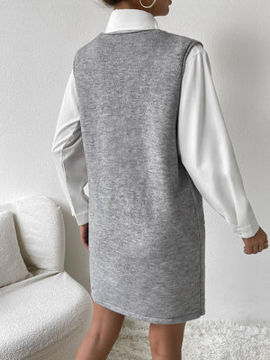 Sleeveless knit mini dress in dark gray, styled with a white collared shirt.