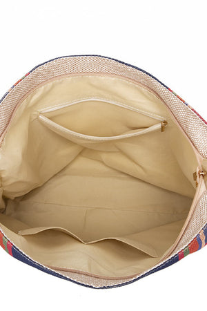 Southwestern hobo bag interior with multicolor stripes, canvas material, and multiple pockets.
