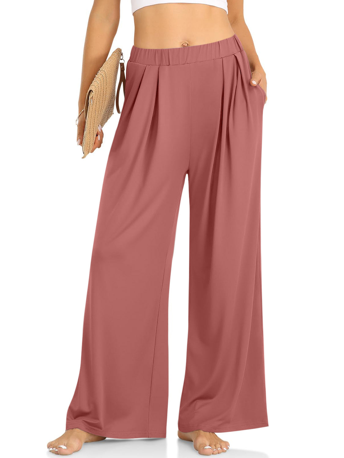 Pleated palazzo trousers in burnt coral with pockets and a wide leg