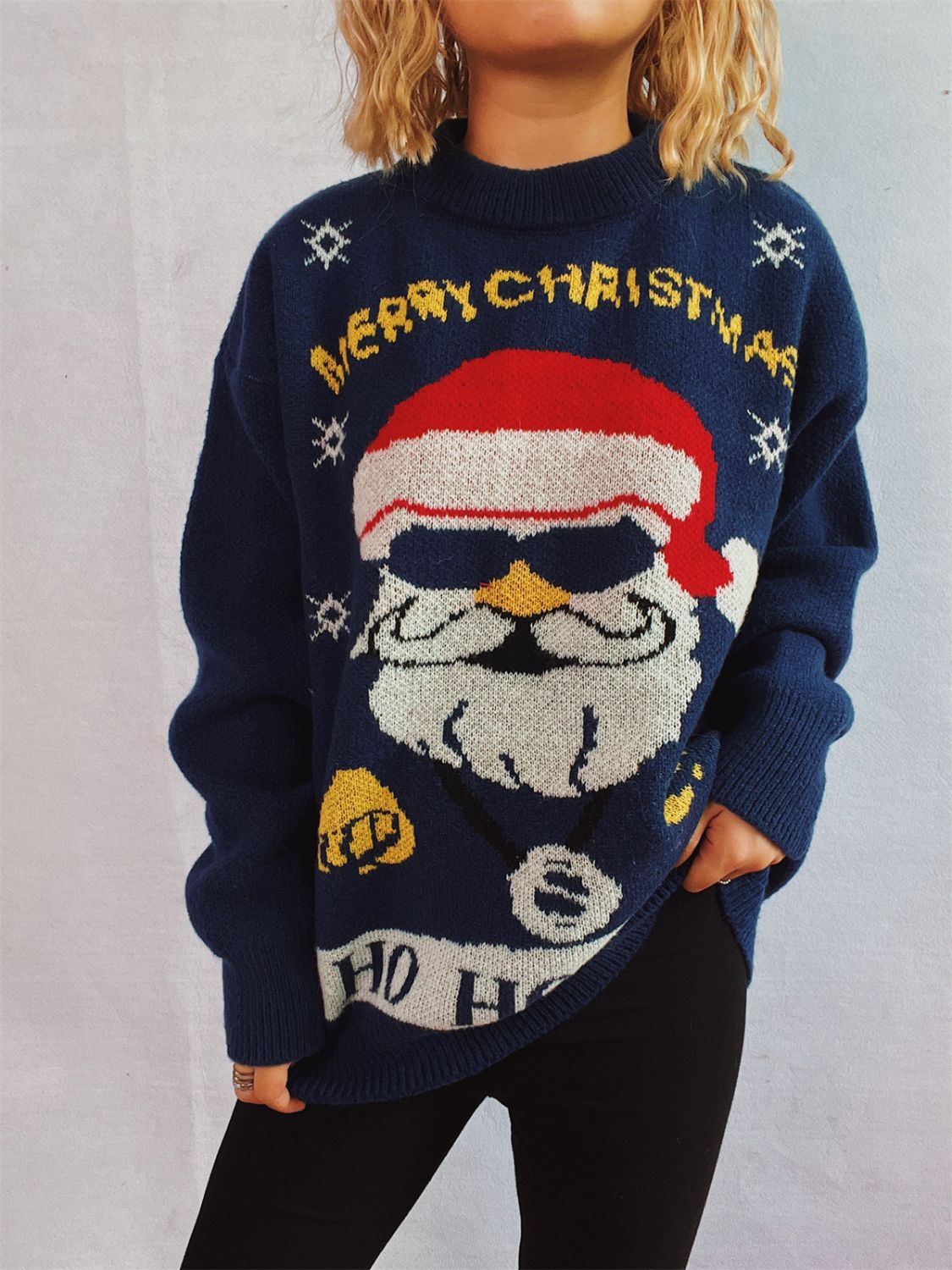 Dark blue acrylic knit sweater with a cool Santa graphic and Merry Christmas text.