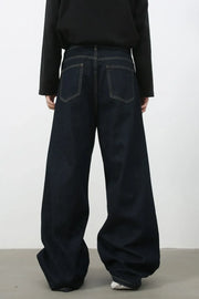 Dark denim exaggerated wide leg jeans with contrast stitching and back pockets.