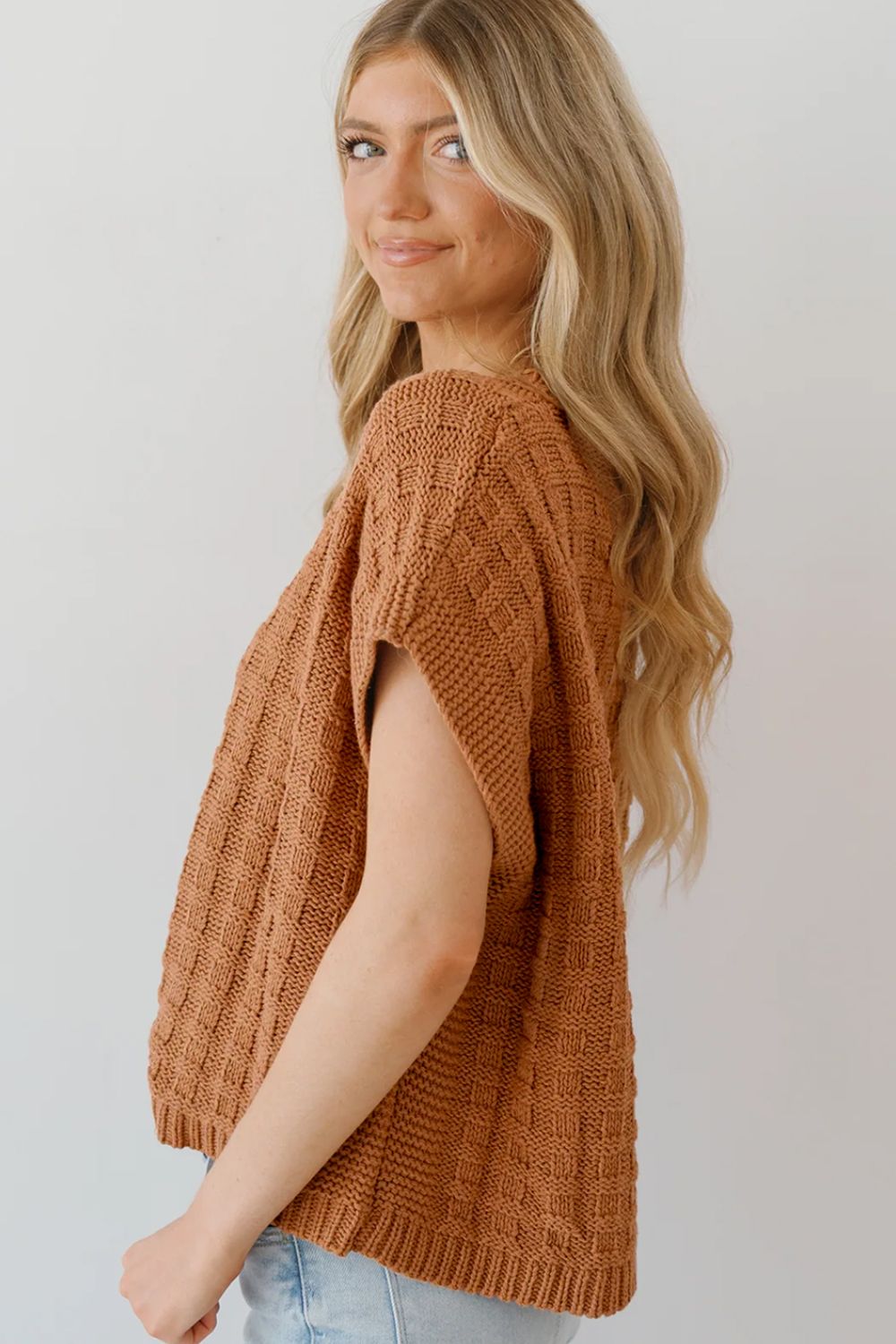 Camel textured knit boxy top with short sleeves and a square pattern.