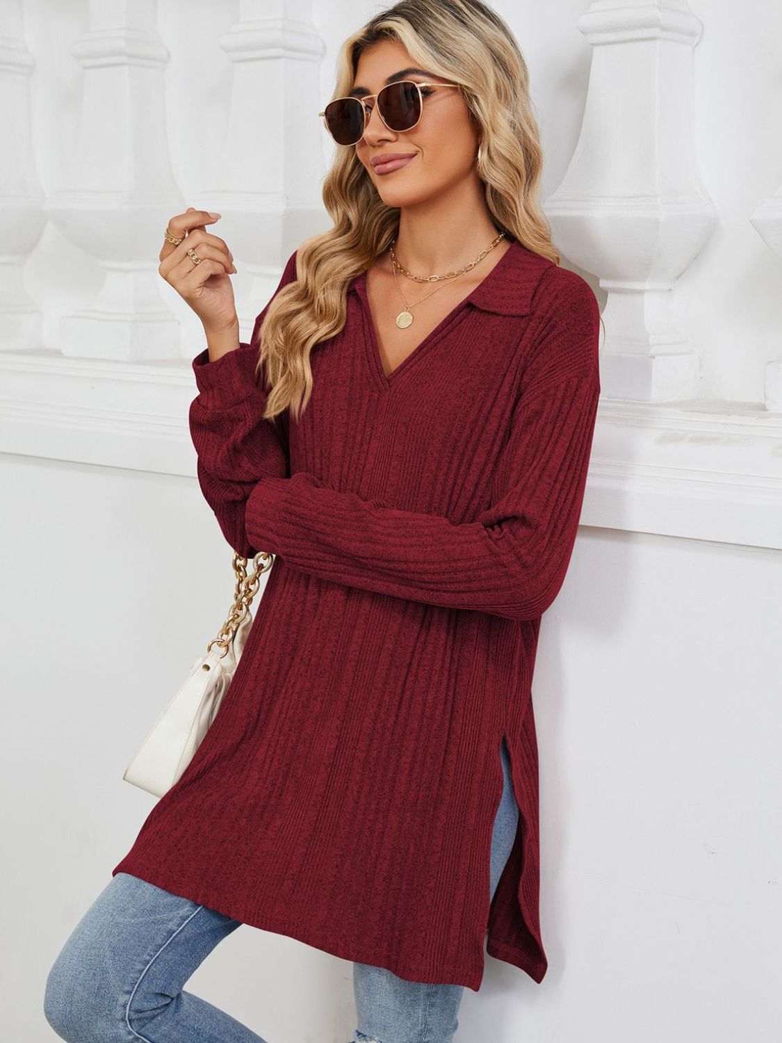 Burgundy ribbed knit collared tunic with slit hem and long sleeves.