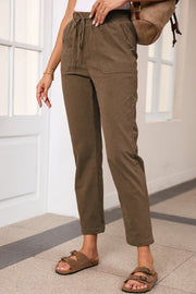 Corduroy drawstring trousers in mocha with slant pockets and a relaxed fit.