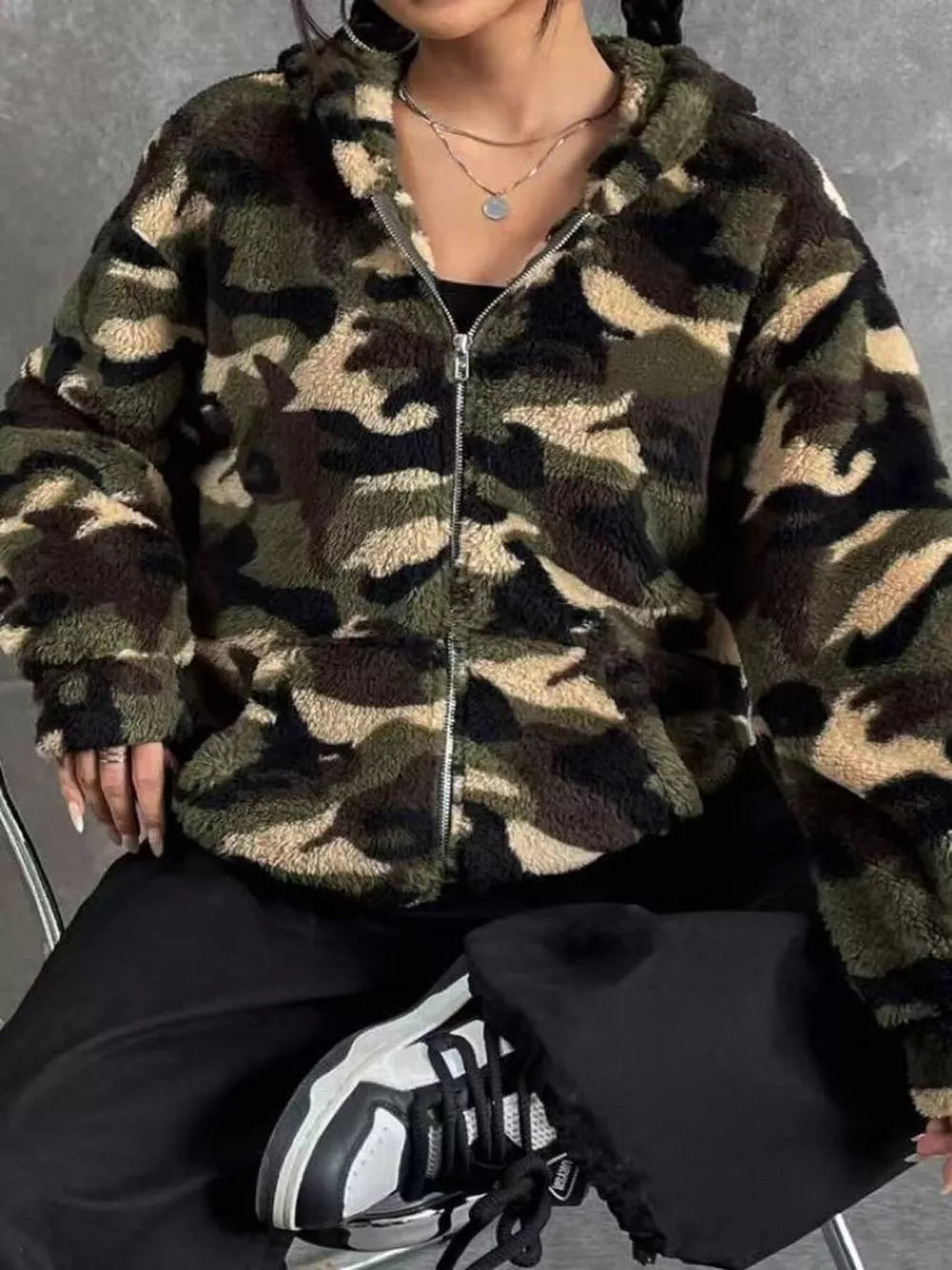 Camo fuzzy zip-up trench coat with hood and pockets.