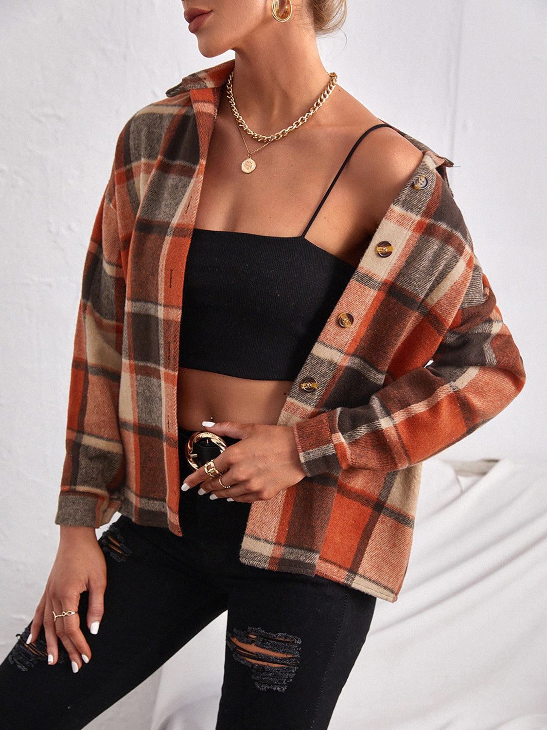 Oversized plaid shacket in ochre with button closure, open collar, and long sleeves.
