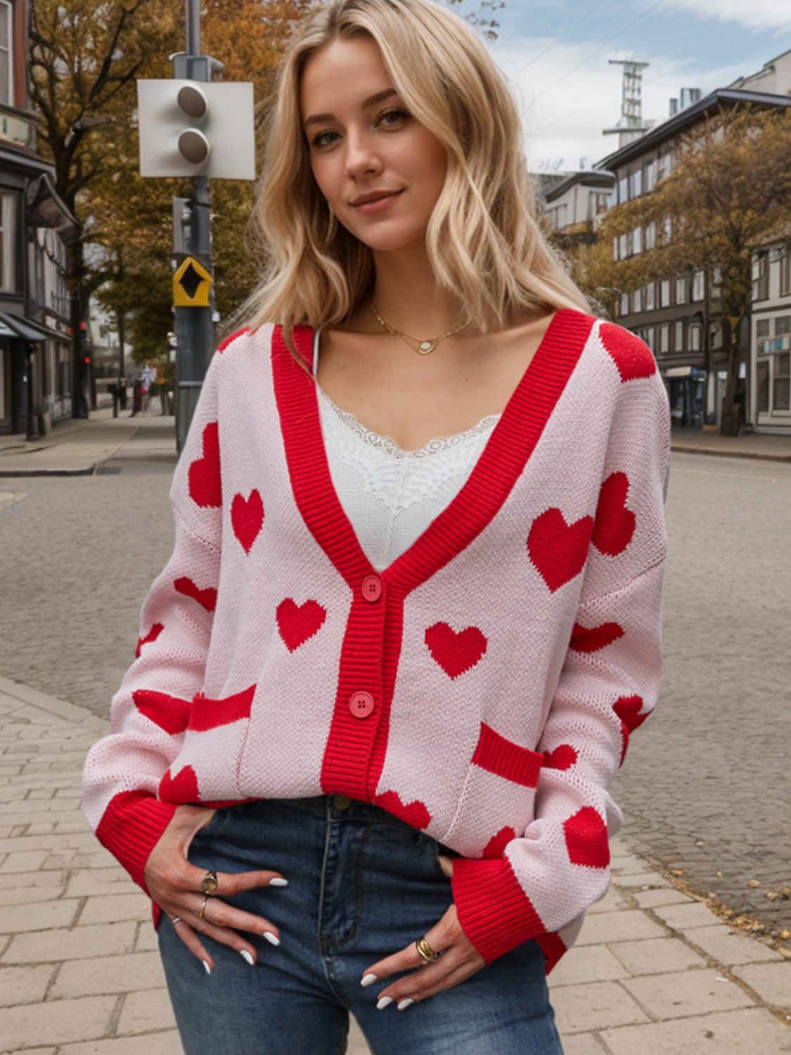 Love Letter Intarsia Knit Cardigan in pink with red hearts, v-neck, button front, and pockets.