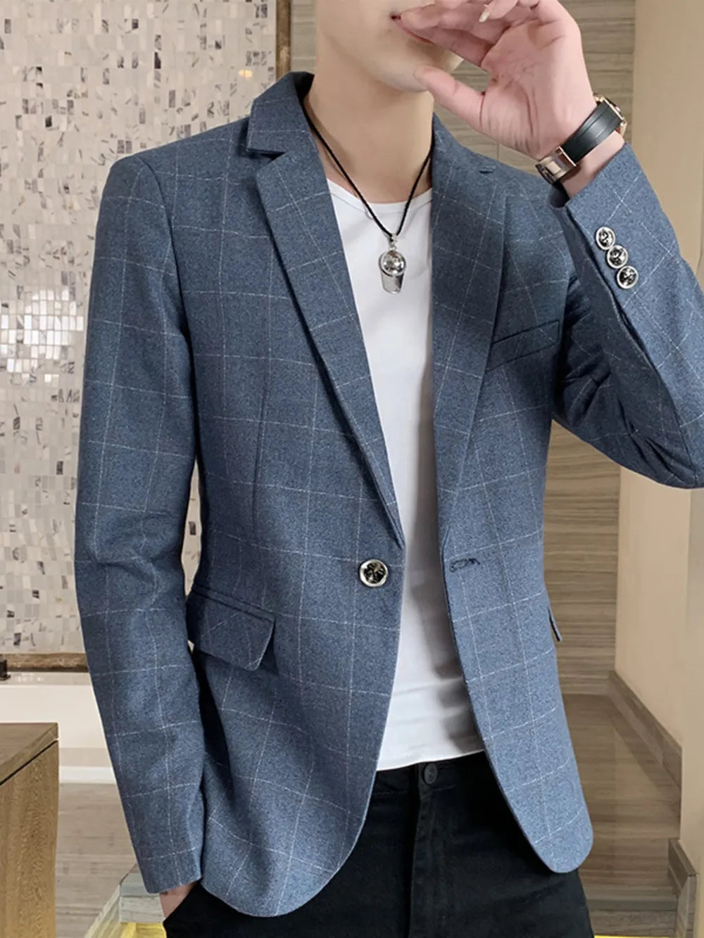 Light blue plaid sport jacket with button closure and notched lapels.