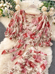 Chic floral two-piece crop set with puff sleeves and a tie-front top in pink and red floral print.