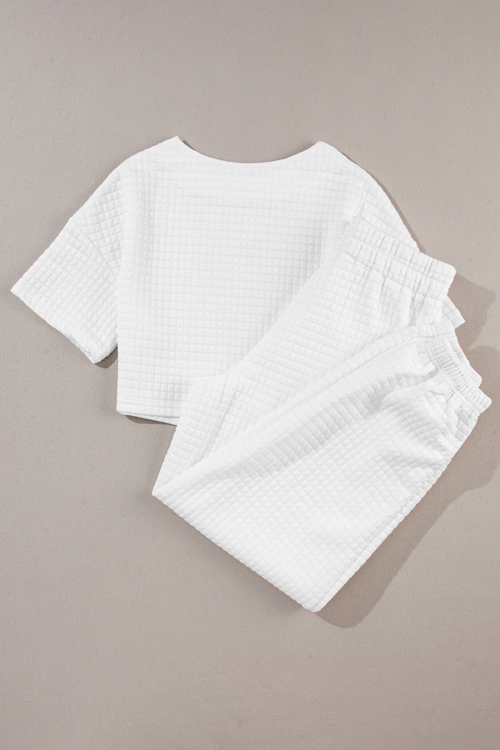 White quilted knit crop top and jogger set with elastic waistband