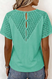 Green waffle knit shirt with lace back detail and button closure