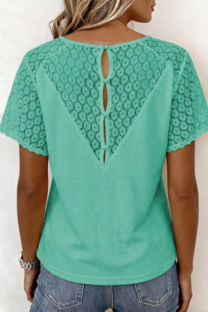 Green waffle knit shirt with lace back detail and button closure