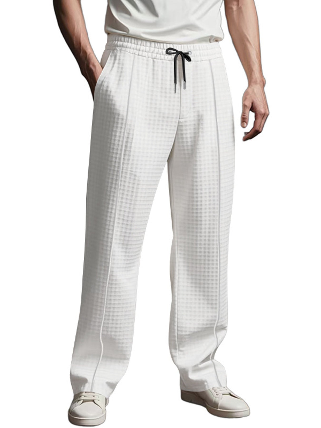 White textured drawstring sweatpants with a casual fit and pockets.