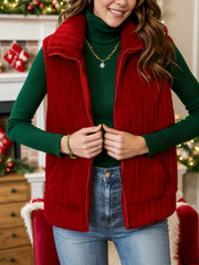Plush corduroy zip-up gilet in rust with a stand-up collar.