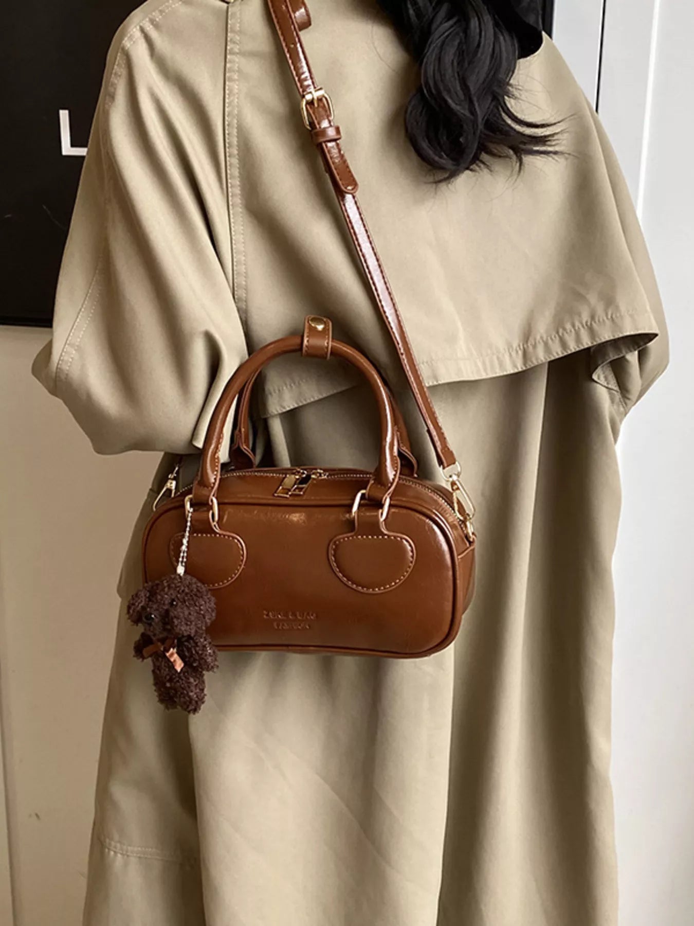 Chic mini crossbody bag in chocolate PU leather with top handles and teddy bear charm