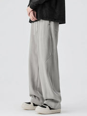 Light gray jogger pants with drawstring and pockets.