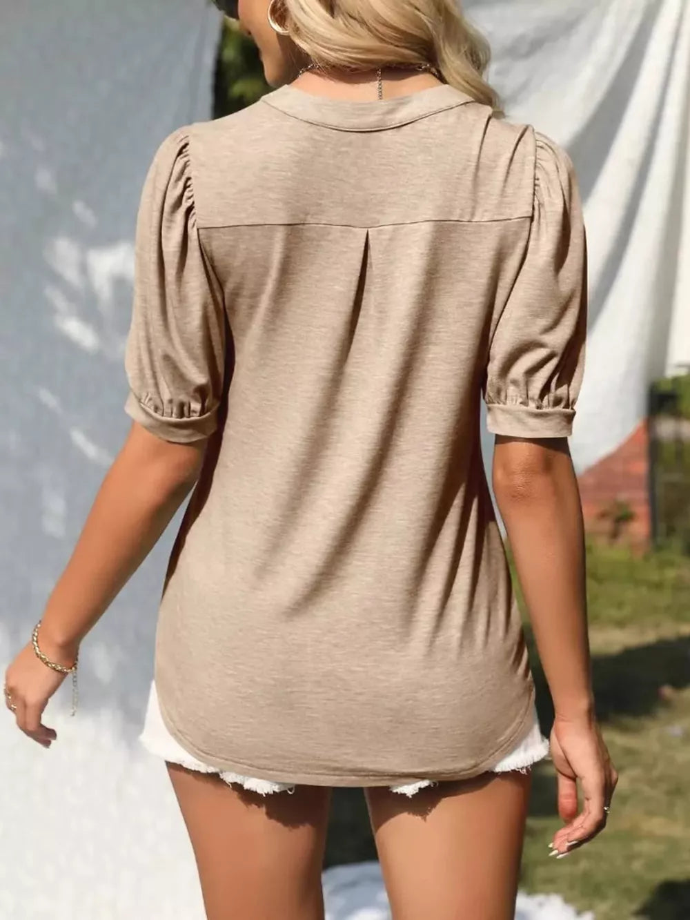 Camel puff sleeve t-shirt with notched V-neck and back pleat detail.