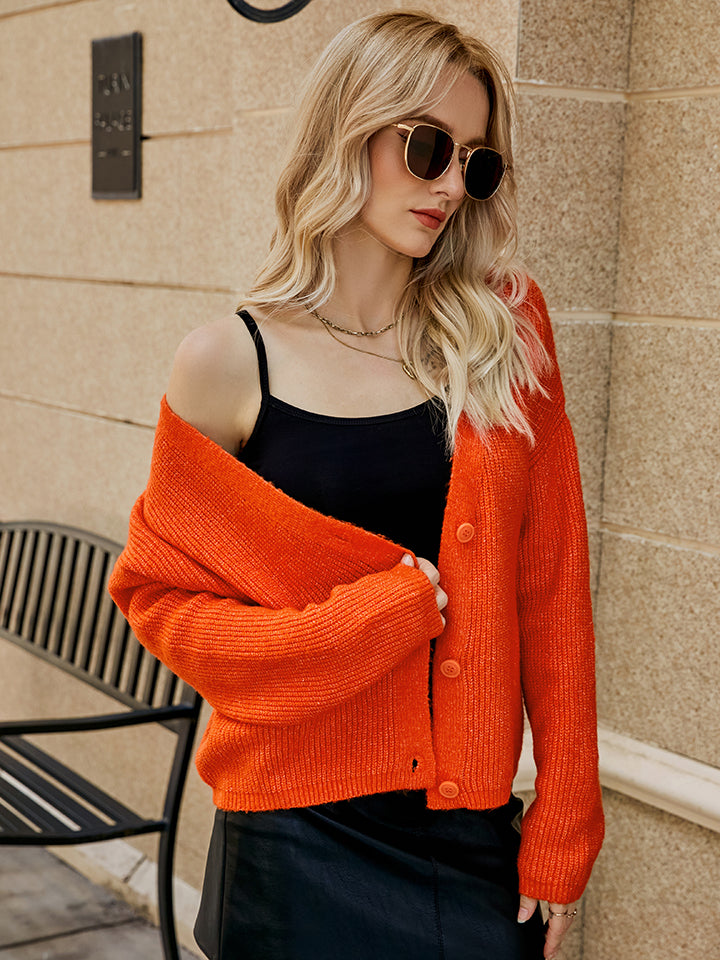 Orange-Red textured button-down knit cardigan with ribbed details