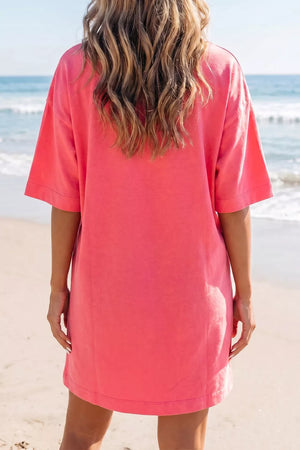 Coral cotton blend t-shirt mini dress with crew neck and drop shoulders.