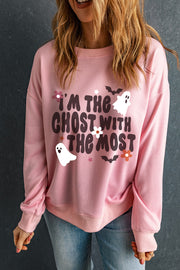 Blush pink crewneck sweatshirt with "I'm the ghost with the most" graphic, ghosts, bats, and flowers.