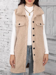 Tan sherpa utility vest with collar, button front, and chest pockets.