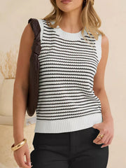 Textured striped knit sweater vest in white and black, crewneck, sleeveless, relaxed fit.