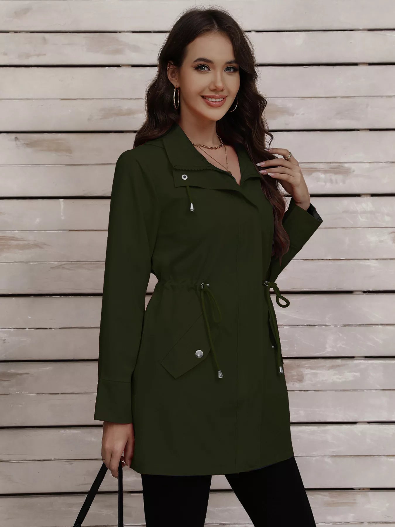 Military green drawstring trench coat with snap-down detail and cinched waist