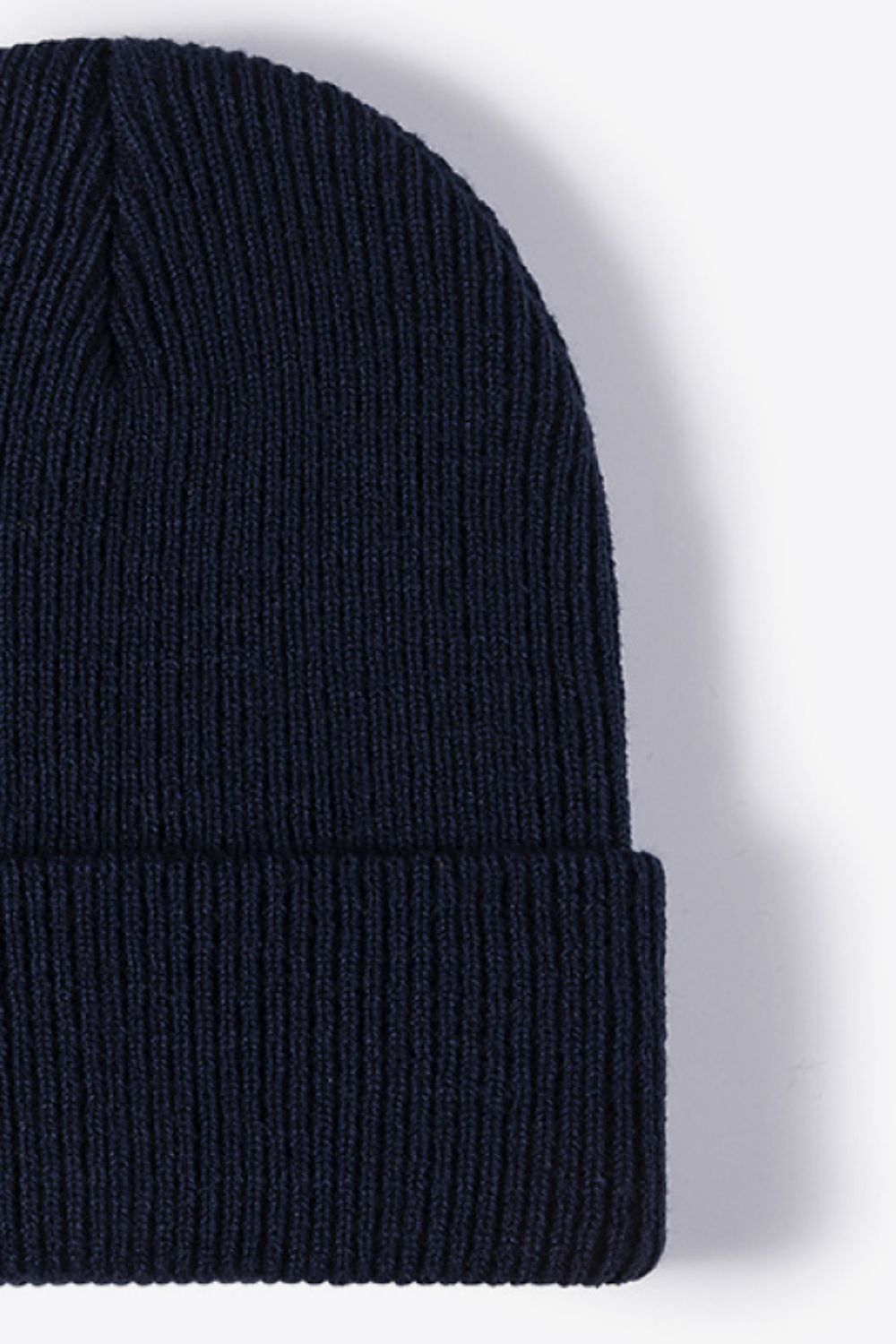 Navy ribbed knit beanie with a cuffed hem