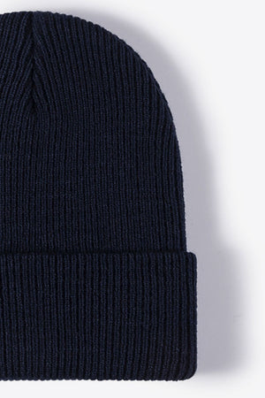 Navy ribbed knit beanie with a cuffed hem