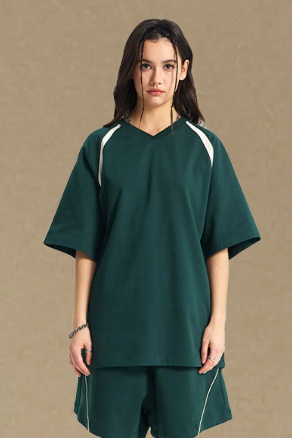 Dark Green V-neck raglan tee with white contrast detail on sleeves.
