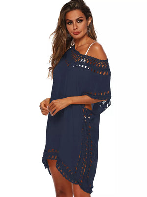 Navy blue crochet V-neck cover-up dress with cutout details and fringe trim.