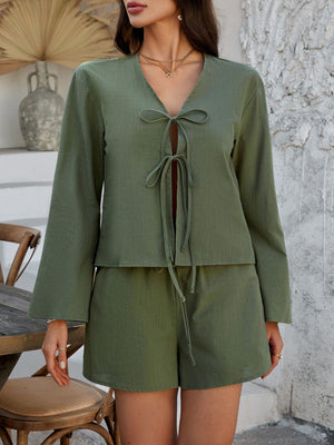 Matcha green linen tie-front top and shorts set with long bell sleeves.
