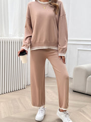 Pale Blush knit lounge set with ribbed trim on neckline, cuffs, and hem.