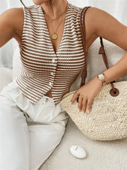 Chic striped knit v-neck tank top with button front, styled with white pants and a straw bag.
