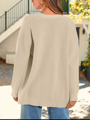 Oversized ribbed knit button-down cardigan in Dust Storm acrylic, with a relaxed fit.
