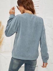 Corduroy crewneck sweatshirt in Deep Teal with a lip print, long sleeves, and relaxed fit.
