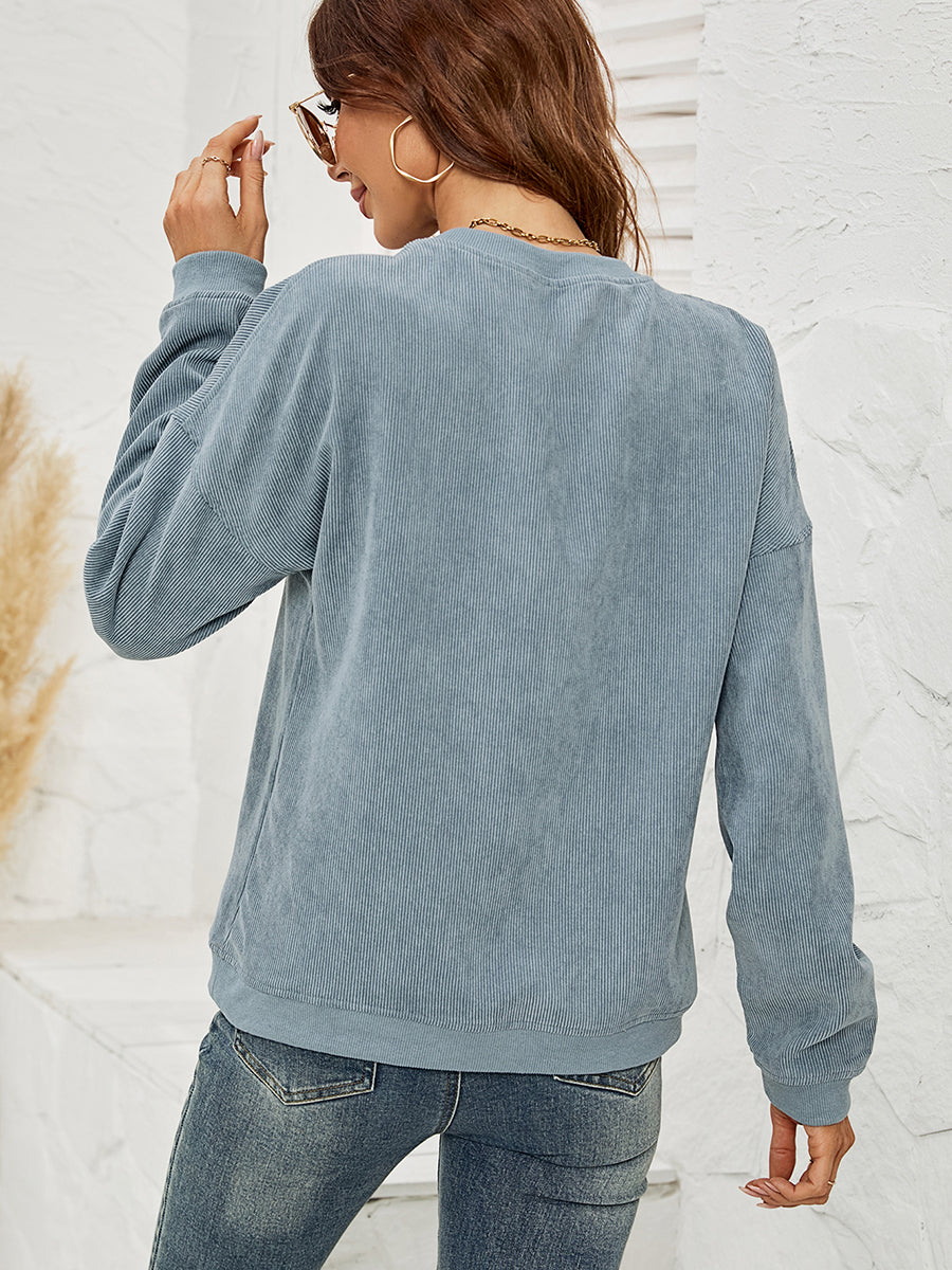 Corduroy crewneck sweatshirt in Deep Teal with a lip print, long sleeves, and relaxed fit.